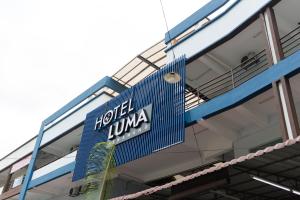 a sign on the side of a building at Hotel Luma Senawang in Seremban