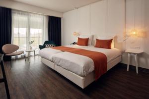 Postel nebo postele na pokoji v ubytování Van der Valk Hotel Breukelen