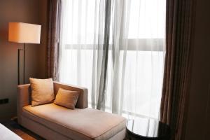 Uma cama ou camas num quarto em Wanda Realm Huangshi