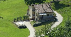 an aerial view of a house in a field at Cerqua Rosara Residence in Valtopina
