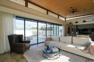 a living room with a couch and a chair at Villa WANNY in Nathon Bay