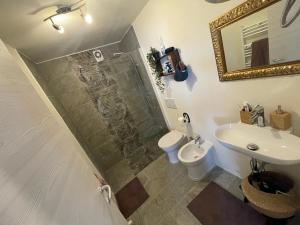 a bathroom with a shower and a toilet and a sink at Le Bon Bon CIR-TORGNON-0017 in Torgnon +8 photos