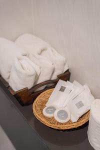 a basket of towels and a basket of towels at Manee Cool Mueang in Chiang Mai