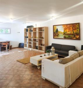 a living room with a couch and a table at Sotogrande. Estancia privada en plena naturaleza in Sotogrande