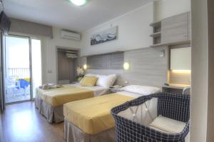 Postel nebo postele na pokoji v ubytování Hotel Colorado