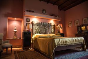 a bedroom with a bed and a clock on the wall at Country House Style in Montefiascone