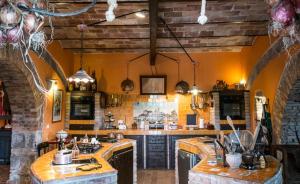 a large kitchen with a large island in a room at Country House Style in Montefiascone