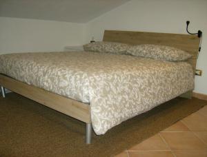 Ένα ή περισσότερα κρεβάτια σε δωμάτιο στο La mansarda di Matteo