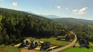 an aerial view of a village in the mountains at Sauna i jacuzzi! Tatra Spa Witów in Witów