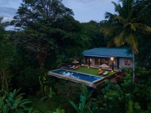 an aerial view of a house with a swimming pool at Mount Havana in Kandy