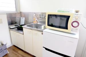 Ett kök eller pentry på Daiichi Mitsumi Corporation - Vacation STAY 15349