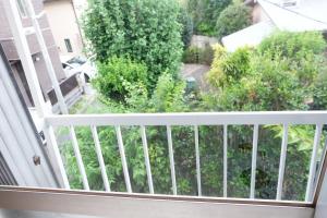 a balcony with a view of a garden at Daiichi Mitsumi Corporation - Vacation STAY 15349 in Musashino