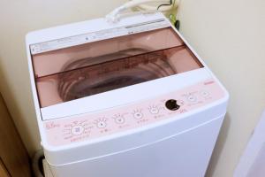 a washer and dryer sitting in a room at Daiichi Mitsumi Corporation - Vacation STAY 15350 in Musashino