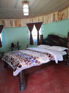 a bedroom with a giraffe bed in a room at Cozy Huts in Nyandarua 