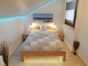 a bedroom with a bed with a view of the ocean at Appartment 007 in Tossens in Butjadingen OT Tossens