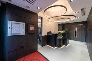 a lobby with a reception desk in a building at Signature London, The J Marylebone in London