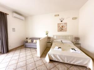 Postel nebo postele na pokoji v ubytování B&B Il Leccio