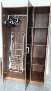 a walk in closet with shelves and shoes in it at SOHO Flat (Central London) in London