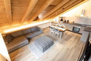 a living room with a couch and a table at Maison Aubert in Centro Storico in Aosta