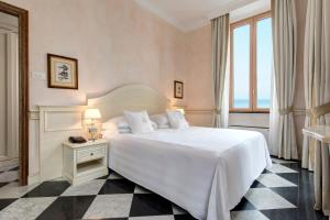 Кровать или кровати в номере Hotel Cenobio Dei Dogi