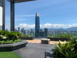 a view of a city skyline from a building at Greystone Continew Residensi in Kuala Lumpur