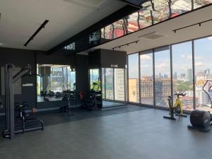 a gym with a view of a city at Greystone Continew Residensi in Kuala Lumpur