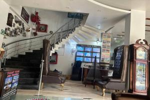 a staircase in a store with chairs and a stair case at HOTEL TODAY INTERNATIONAL in New Delhi