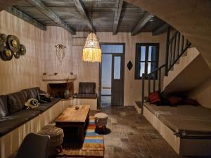 a living room with a couch and a table at Villa Polixeni Gennadi in Gennadi