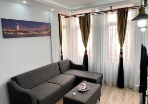 a living room with a couch and a table at Mar Suite in Istanbul