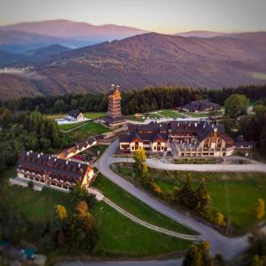 an aerial view of a resort in the mountains at Hotel Beskidzki Raj Medical SPA in Stryszawa