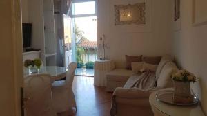 a living room with a couch and a table at Apartment in Lovran 15142 in Lovran