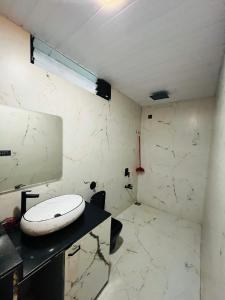 a bathroom with a toilet sitting on a counter at Cloud9 Villa (Yeoor Hills, Thane) - A Luxurious Private Jungle Villa. in Thane