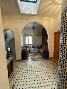 a large living room with an archway and a living room at Dar El Hayet in Tangier