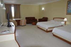 Postel nebo postele na pokoji v ubytování Hotel Sagres