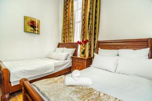 Postel nebo postele na pokoji v ubytování Sera Boutique Hotel