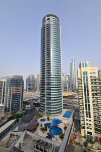 a view of a tall building in a city at Casa Vera Vacations in Dubai