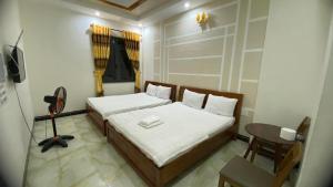 Katil atau katil-katil dalam bilik di Motel Quốc Việt