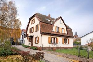 a white house with a black roof at Klostergarten in Grünstadt