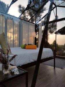 a bedroom with a bed in a room with a window at Costa Vicentina Sky View in Rogil