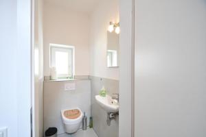 Koupelna v ubytování Packhaus Norderney + 8 fotografií
