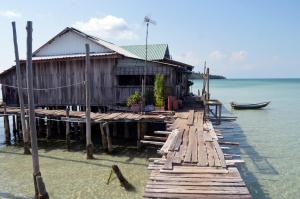 a house on a dock in the water at Salacia's Suite in Koh Rong Island