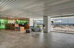 a lobby with a view of the beach at Don Gregory by Dunas - Adults Only in San Agustin