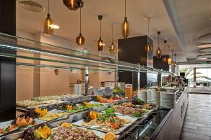 a buffet line with many different types of food at Don Gregory by Dunas - Adults Only in San Agustin