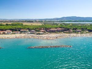 an aerial view of a beach with a crowd of people at Gitavillage Argentario in Albinia