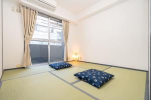Postel nebo postele na pokoji v ubytování Two-bedroom, 6-minute walk to the Yamanote Line