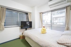 Postel nebo postele na pokoji v ubytování Two-bedroom, 6-minute walk to the Yamanote Line
