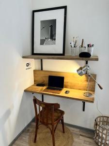 a desk with a laptop computer on top of it at Gorlero Benwi 117 in Punta del Este