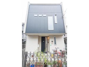 a white house with a black roof at 3 BR house 7 mins on foot from Otsuka on the Yamanote Line in Tokyo