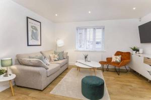 a living room with a couch and a table at York City Apartments in York