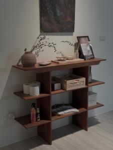a wooden book shelf in a room at Good Day B&B in Magong